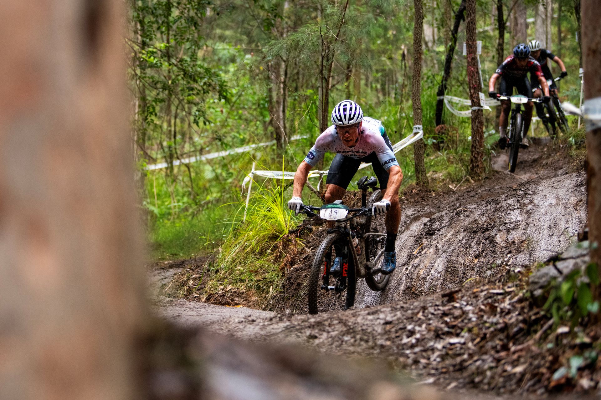 Australian mountain bike rider Cameron Ivory rides down a muddy embankment during the 2024 XCO National Championships in Awaba